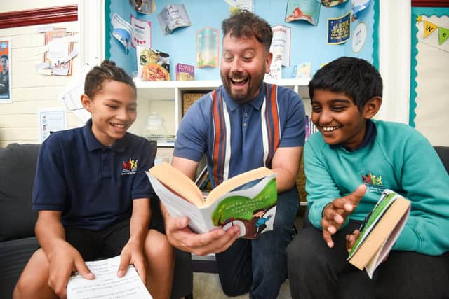 Author Nathan Parker has been working with pupils from Revoe Learning Academy to help improve literacy. He is pictured centre, with pupils J'Kwon Grant, 10 (who conttibuted illustrations to the book), and Aadidev Nair, 10.