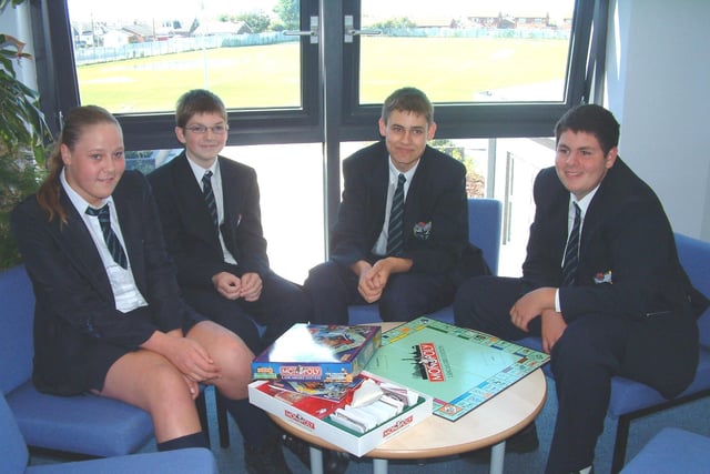 Claire Webster, Peter Brookes, Michael Kennedy and James Clough relax with a game of Monopoly in the school's library