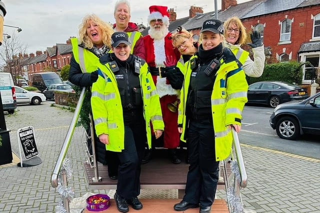 Father Christmas at the St Alban's Road shops on his travels around St Annes ahead of the afternoon entertainment, accompanied by town councillors and two police community support officers. Picture: Kitty Mion-Bouman, St Annes Town Council