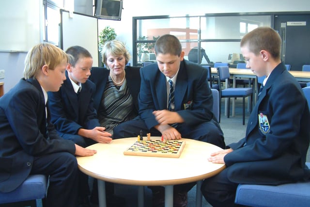 Chess in the library - Steven Reid, Jamie Stevenson, Ian Porter and Christopher Bainbridge enjoy a game of chess with headteacher Margaret Dudley