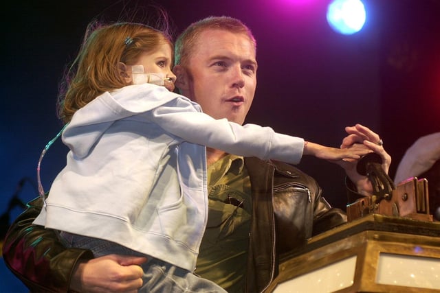 Ronan Keating, helped by Kirsty Howard, switched on the lights in 2002