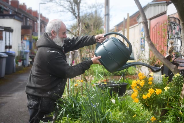 A group of residents have created a community garden in their alleyway called Strawberry Gardens. Pictured is Paul Ogden.