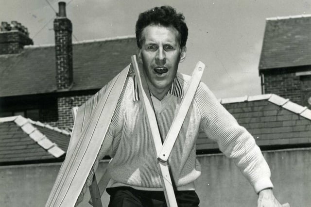 Bruce Forsyth has trouble with his deckchair in Blackpool in 1960
