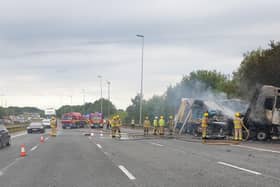 Fire crews working at the scene of the lorry fire on the M6 in Preston this morning (Friday, July 29)