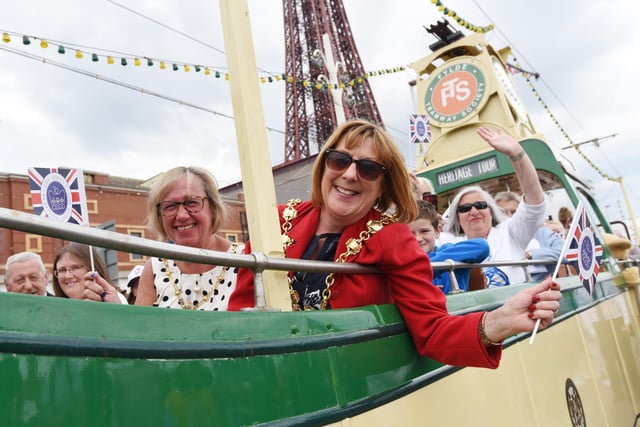 A wave to the crowds as thousands of people line Blackpool promenade for the heritage tram parade