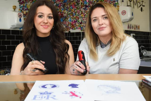 A new tattoo studio on Lytham Road will be doing Queen Elizabeth tattoo designs and donataing some of the proceeds to charity. Pitcured are Katy Shaw and Zoe Neil from Ext-INK-tion.