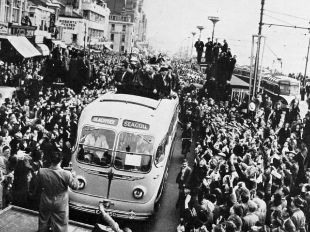 The triumphant team tour Blackpool in a Seagull coach, seen on the promenade as they approach Talbot Square