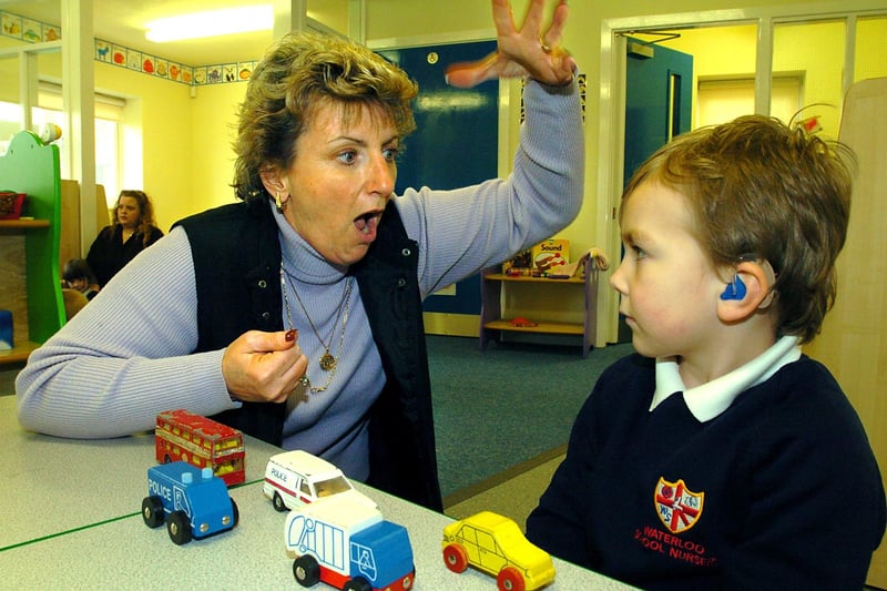 Waterloo Primary School SERF (Special Education Resource Facility) at the nursery. Four year old Rylan Casey who had hearing impairment, with Teacher of the Deaf Jan Barlow signing to him, 2004