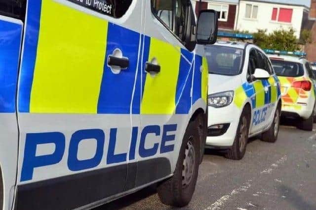 A police investigation was launched after a woman was spotted being bundled into a van in Whitegate Drive at 11.05pm on Wednesday (April 13)