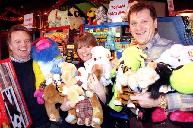 Pass the Parcel: Mandy Hedley of Boots collects toys from Charles Henry Hart of Harts Amusements and Warwick Tunnicliffe of Warwicks Amusements, 1999