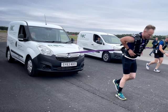 John and James pulling their vans at the start line