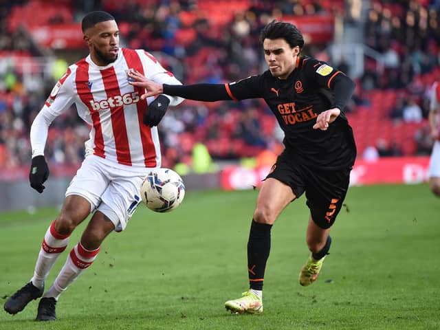STOKE ON TRENT, ENGLAND - MARCH 05: Tyrese Campbell of Stoke City runs past Reece James of Blackpool during the Sky Bet Championship match between Stoke City and Blackpool at Bet365 Stadium on March 05, 2022 in Stoke on Trent, England. (Photo by Nathan Stirk/Getty Images)