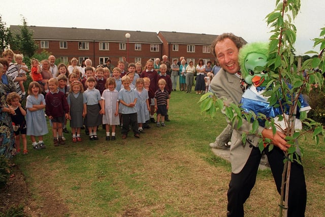 Keith Harris and Orville help to plant a tree at Marton County Primary School, Blackpool