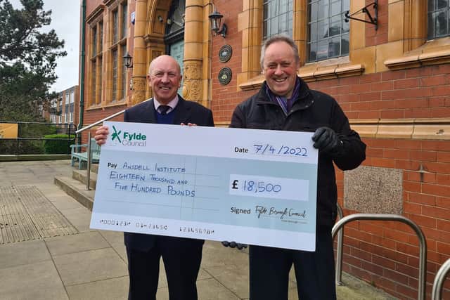 Fylde Council deputy leader Coun Roger Small (right) presents an ARG cheque for £18,500 to Coun Ben Aitken, chairman of thge Friends of Ansdell Institute.