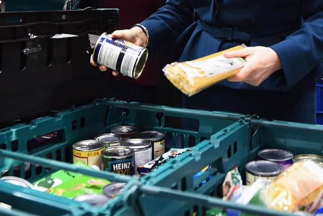 File photo dated 17/01/18 of goods at a food bank. The cost-of-living crisis is driving food banks to "breaking point" with almost 1.3 million emergency parcels given to people in hunger over just six months, a leading charity has said. Issue date: Thursday November 10, 2022. PA Photo. The Trussell Trust issued a stark warning on Thursday after new research showed record-breaking levels of need, with one in five individuals referred to its network now coming from working households. See PA story CHARITY Foodbanks. Photo credit should read: Andy Buchanan/PA Wire