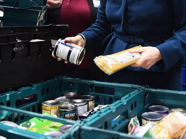File photo dated 17/01/18 of goods at a food bank. The cost-of-living crisis is driving food banks to "breaking point" with almost 1.3 million emergency parcels given to people in hunger over just six months, a leading charity has said. Issue date: Thursday November 10, 2022. PA Photo. The Trussell Trust issued a stark warning on Thursday after new research showed record-breaking levels of need, with one in five individuals referred to its network now coming from working households. See PA story CHARITY Foodbanks. Photo credit should read: Andy Buchanan/PA Wire