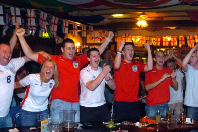 Fans celebrate during the England and Ecuador match at the Boar's Head in 2006