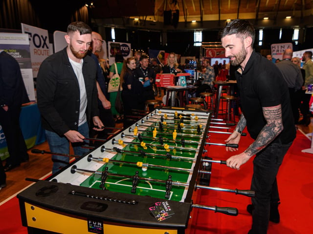 Visitors at Lancashire Business Expo 2022 play table football. Photo: Kelvin Stuttard
