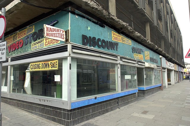 Out with the old - shops empty on Albert Road ready for the redevelopment of Houndshill, 2004. This was a video and discount store which looked like it sold naughty novelties