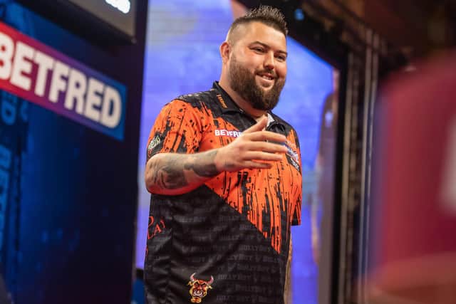 Michael Smith was victorious against Steve Beaton in Blackpool on Sunday night Picture: Taylor Lanning/PDC