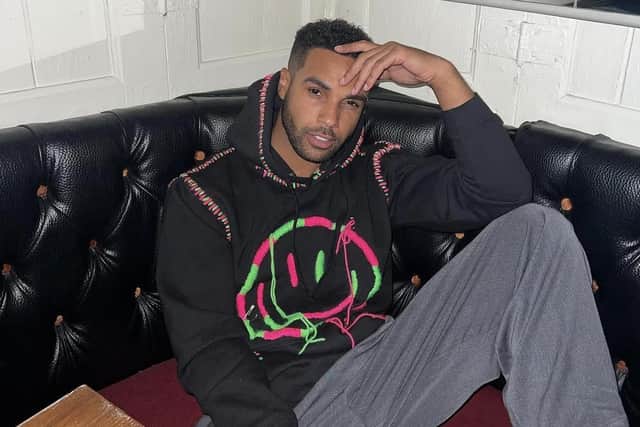 Actor Lucien Laviscount proudly wears one of Lisa Marie Tart's tops