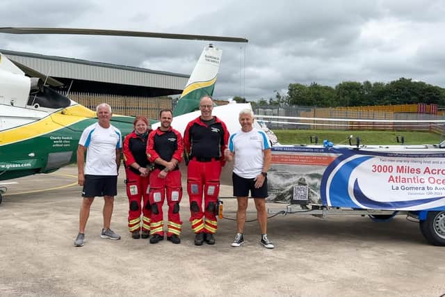 Garry Hoyle (left) and David Ferrier (right) with representatives from the Great North Air Ambulance Service