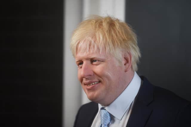 A wax figure of Prime Minister Boris Johnson is unveiled at Madame Tussauds