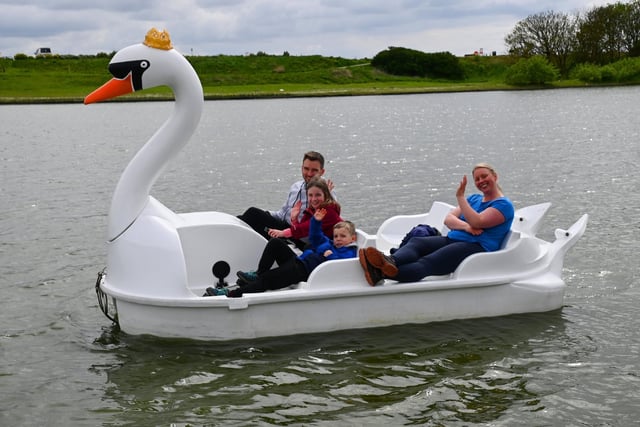 A family has fun on a royal swan at the Coronation After Party.