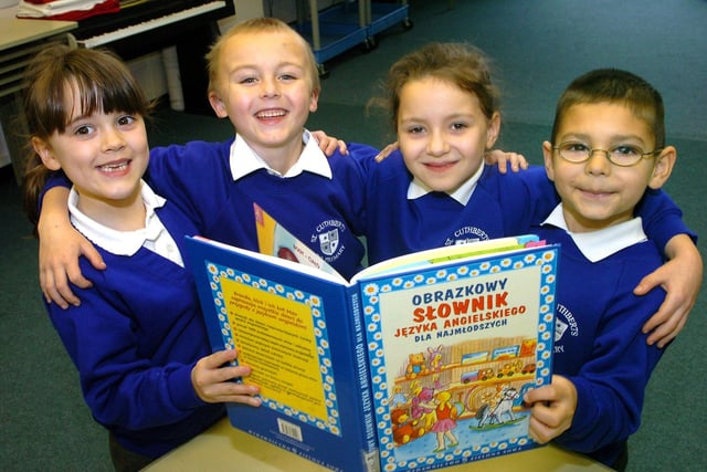 English and Polish children at St Cuthbert's Catholic Primary School, Blackpool. From left: Annie, six, Harry, six, Kinga, seven, and Klaudiausz, six