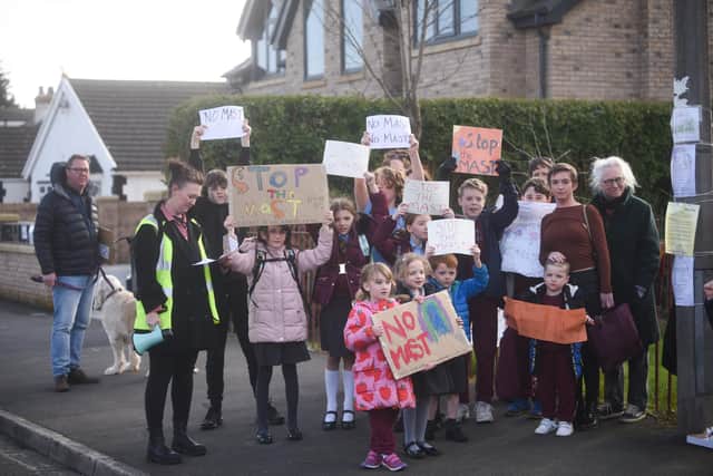 Residents protest with parents and pupils of Thornton Cleveleys Baines Endowed Primary School over plans to install a 5G mast outside the outdoor learning and woodland area.