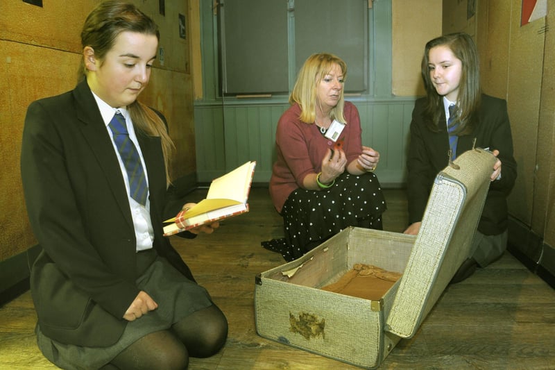 The Anne Frank exhibition at Blackpool's City Learning Centre. St Mary's Catholic High School pupils Lucy Cross (left) and Alice Townsend (both aged 13) with Marian McQueen (Project Officer-Anne Frank Trust UK)
