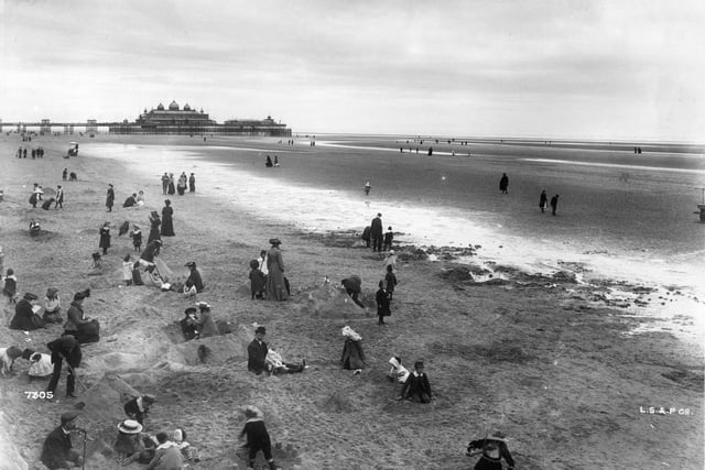 This pictures is from a completely different time, but still resonates today. Families enjoy the beach at Blackpool with the North Pier visible in the background in 1903