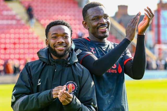Shayden Morris and Toto Nsiala applaud the Fleetwood Town fans who travelled to Crewe Alexandra