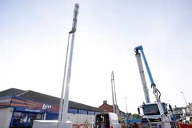 A mobile phone mast being installed on Whitegate Drive