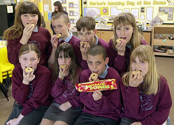 These pupils from Marton Primary School gave the Jammie Dodger a make-over at Burton's Biscuits. Pictured at the front are Elizabeth Whitehead, Leigh Robinson, Daniel Penswick, Chloe Livsey. Back - Sarah Simkin, Carl Bonney, Dane Tweedale, Danielle Johnsan, 2001