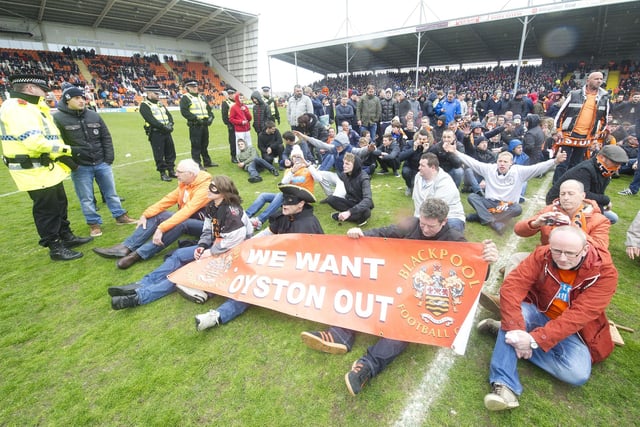 Blackpool's final day game against Huddersfield was abandoned after supporters invaded the pitch to protest against the Oystons.
