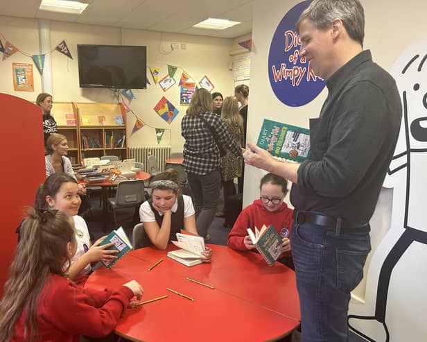 Author Jeff Kinney talks to youngsters about his book, Diary of a Wimpy Kid