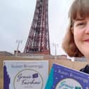 Susan with her two Blackpool-set books in front of the tower