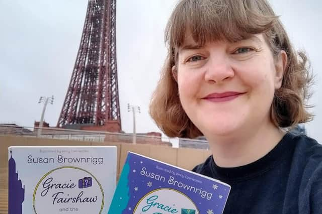 Susan with her two Blackpool-set books in front of the tower