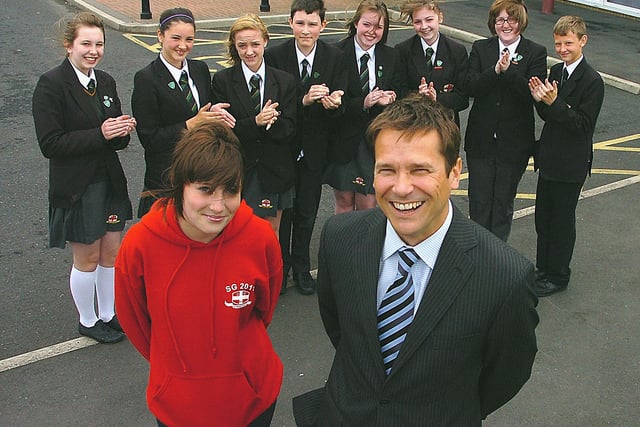 Former Gazette editor David Helliwell is  pictured at St Georges CE High School  with Stephanie Heyes and members of the school council (from left), Bethany Chipping, Lucy Cox, Chloe Cheetham, Mark Grimshaw, Hannah Hilton, Sophie Monaghan-Chell, Genna Whiteley and Jack Stinger