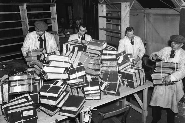 An old one here from 1940. Civil servants at work sorting bound files at a famous hotel in Blackpool (Norbreck Hydro?) which was being used as a Civil Service office