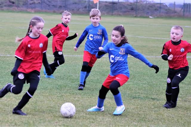 Match of the week action between South Shore Youth Reds Under-8s and Kirkham Junior Blues  Picture: B&DYFL