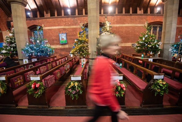 The pews are festooned with colourful displays at the St Annes Parish Church Christmas Tree Festival.