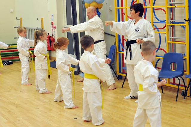 Karate instructors Sensei Julie and Sensei Tony Baker with class at Norbridge Academy