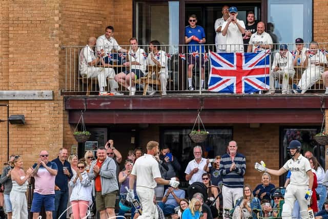 The fans salute Andrew Flintoff (front left) as he leaves the field after his batting stint in the charity match at St Annes. Picture: Adam Gee.