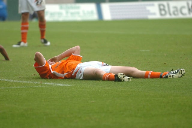 Claus Jorgensen lies on the pitch after nearly scoring for Blackpool. He had flung himself bravely into a leftfoot shot from Ben Burgess’ s knockdown but  Weale was there to make a terrific stop