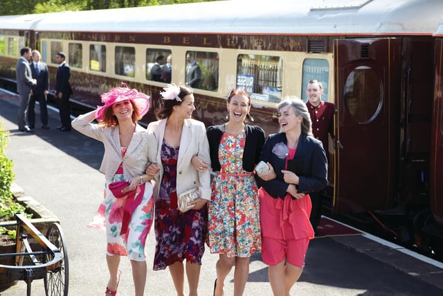 All aboard ... happy passengers about t board the 1930s Pullman-style carriages