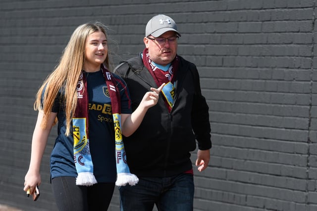 Burnley fans arrive at Turf Moor ahead of the Lancashire Derby with Blackpool. Photo: Kelvin Stuttard