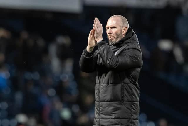 Michael Appleton applauds the travelling fans at the full-time whistle
