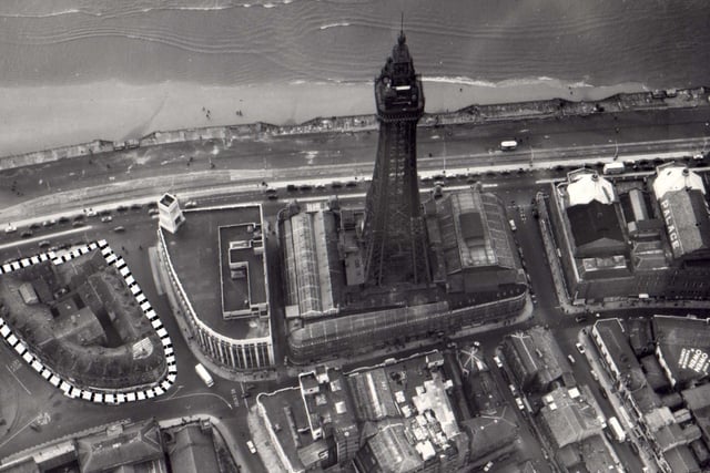 A bird's eye view of the Promenade in the late 1950s showing Blackpool Tower and the Palace Building. Woolworths building is to the left
